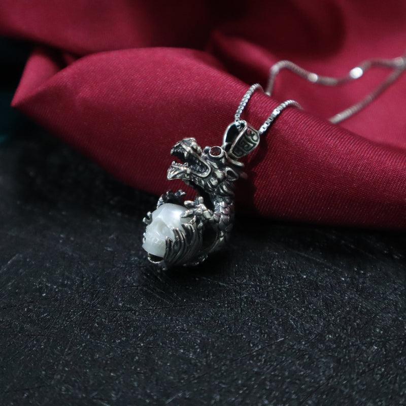 Belle Juri Dragon Holding Pearl Skull Necklace