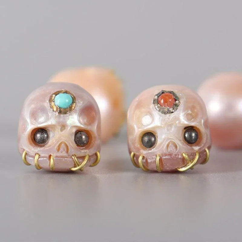 Belle Juri Light Orchid Pearl Carved Śmaśana Skull Bead With Golden & Black Eyes
