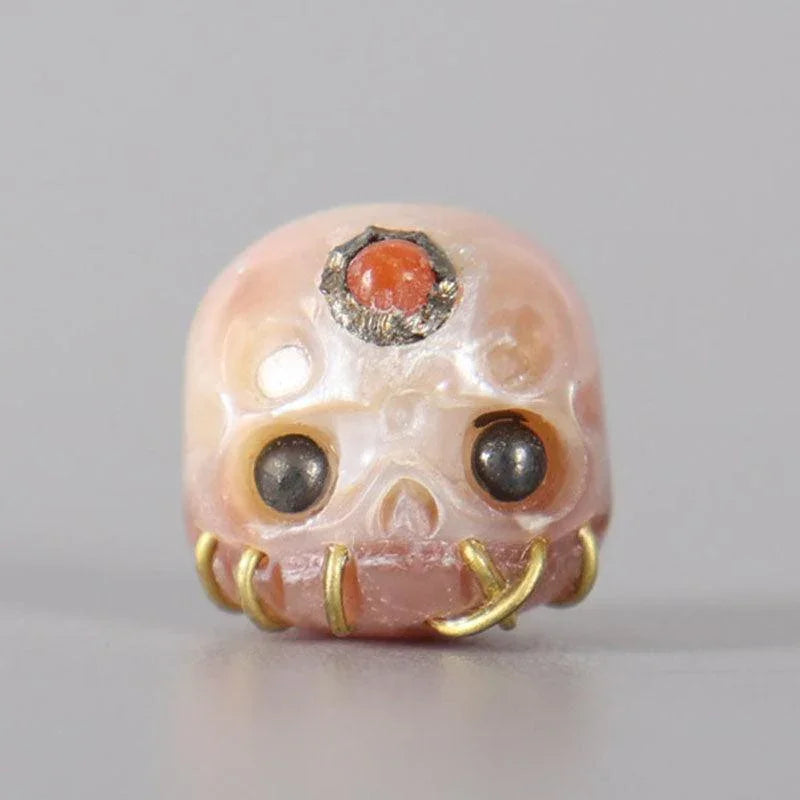 Belle Juri Light Orchid Pearl Carved Śmaśana Skull Bead With Golden & Black Eyes