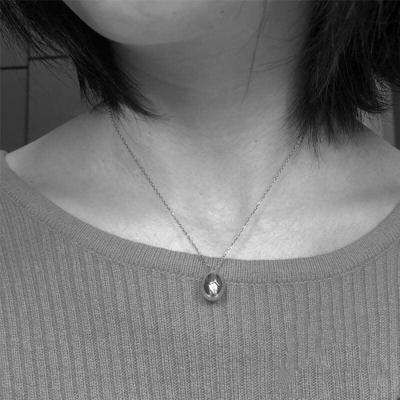 Belle Juri Openable Silver Eggshell Pearl Skull Necklace