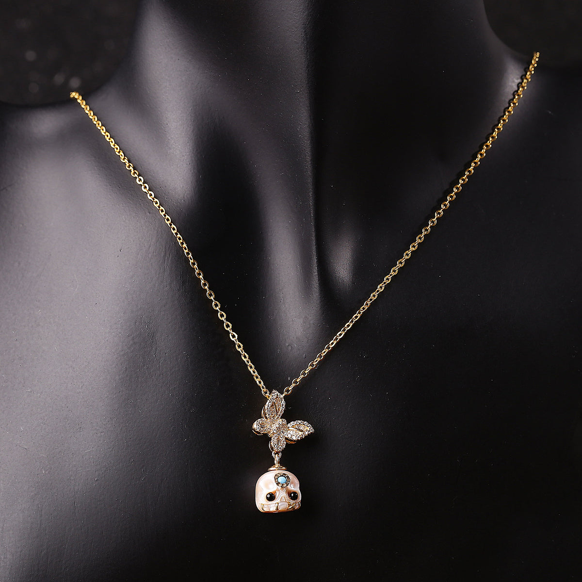 Flying Zircon Butterfly Śmaśana Carved Pearl Skull Necklace