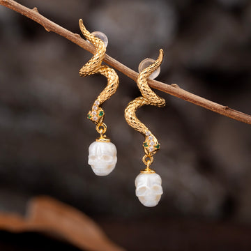 Boucles d'oreilles de crâne de perle de serpent doré