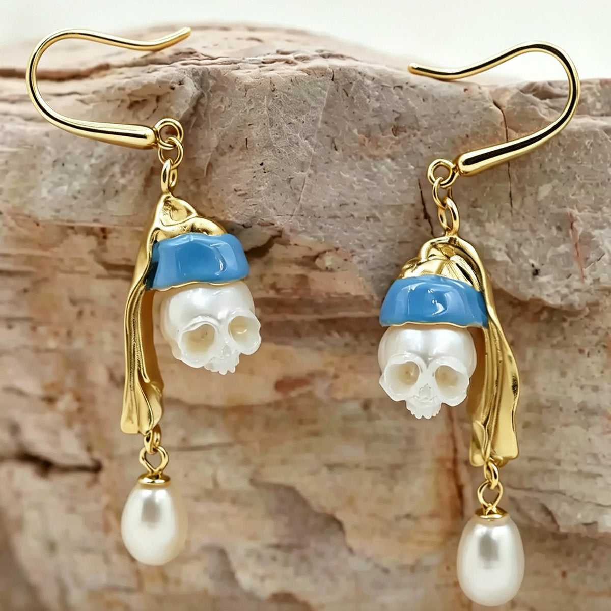 Hand-carved figure of a girl wearing pearl skull earrings