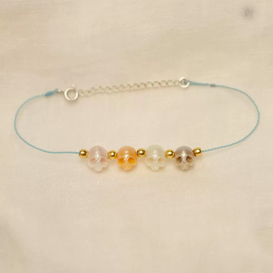 Hand-carved natural pearl bracelet with braided wax cord