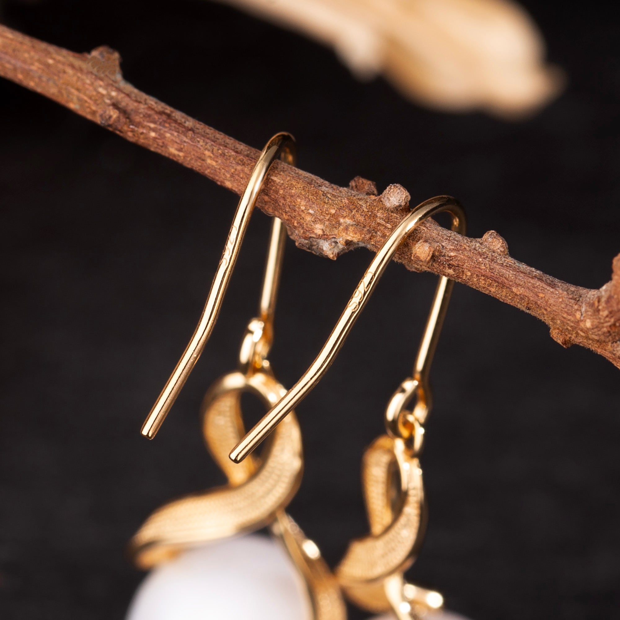 Interlaced Ribbon Pearl Skull Earrings