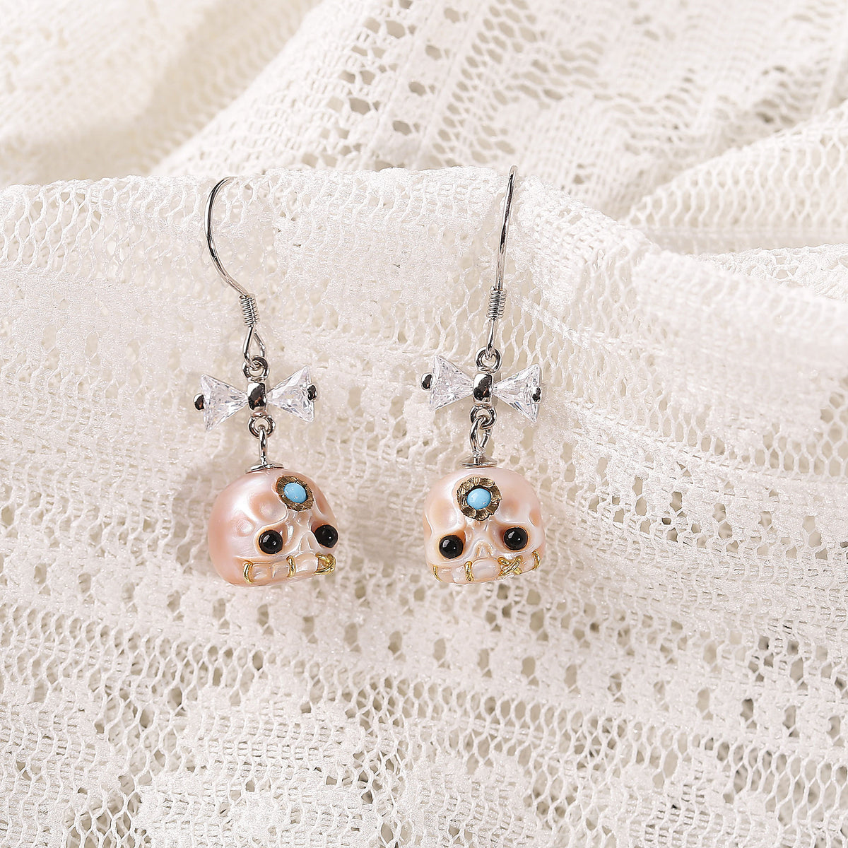 CZ Bow Carved Pearl Skull Śmaśana Fish Hook Earrings