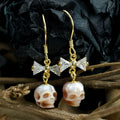 CZ Bow Pearl Skull Hook oorbellen