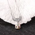 CZ Cluster Feather Wings Necklace Featuring Carved Pearl Skull Śmaśana