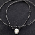 Collier de crâne de perle tressé double