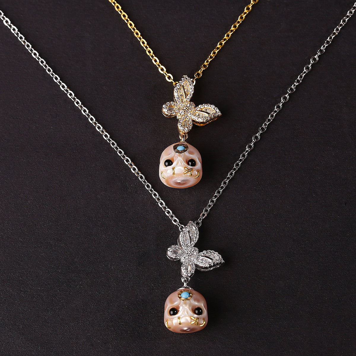 Flying Zircon Butterfly Śmaśana Carved Pearl Skull Necklace