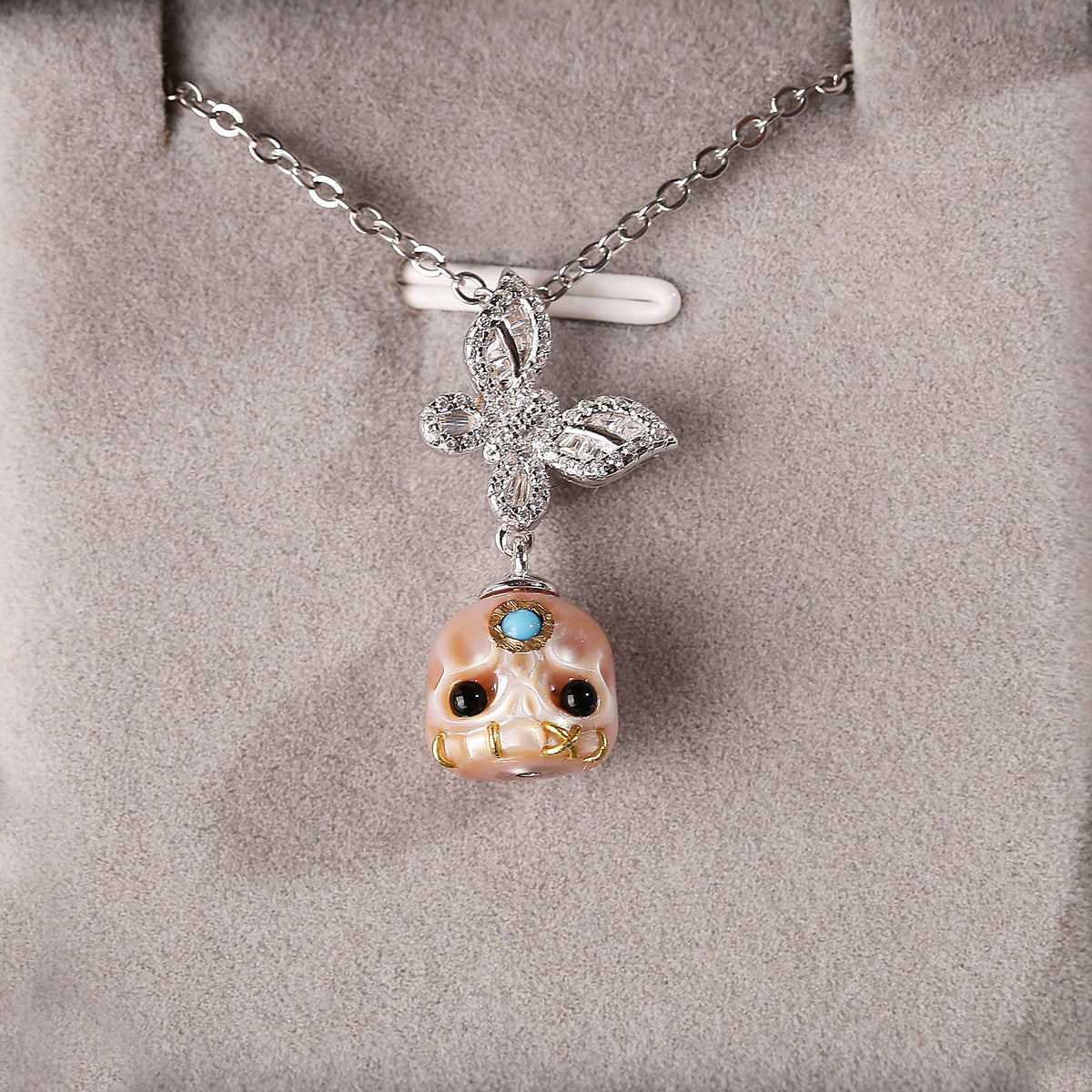 Flying Zircon Butterfly Śmaśana Carved Pearl Skull Necklace