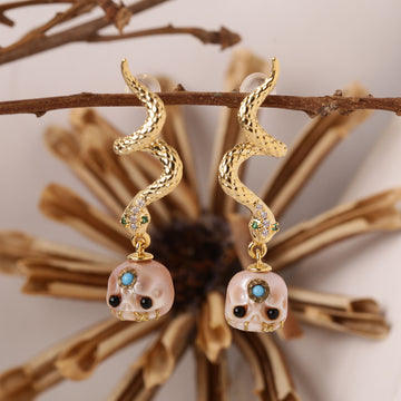 Boucles d'oreilles de crâne de perle de serpent doré
