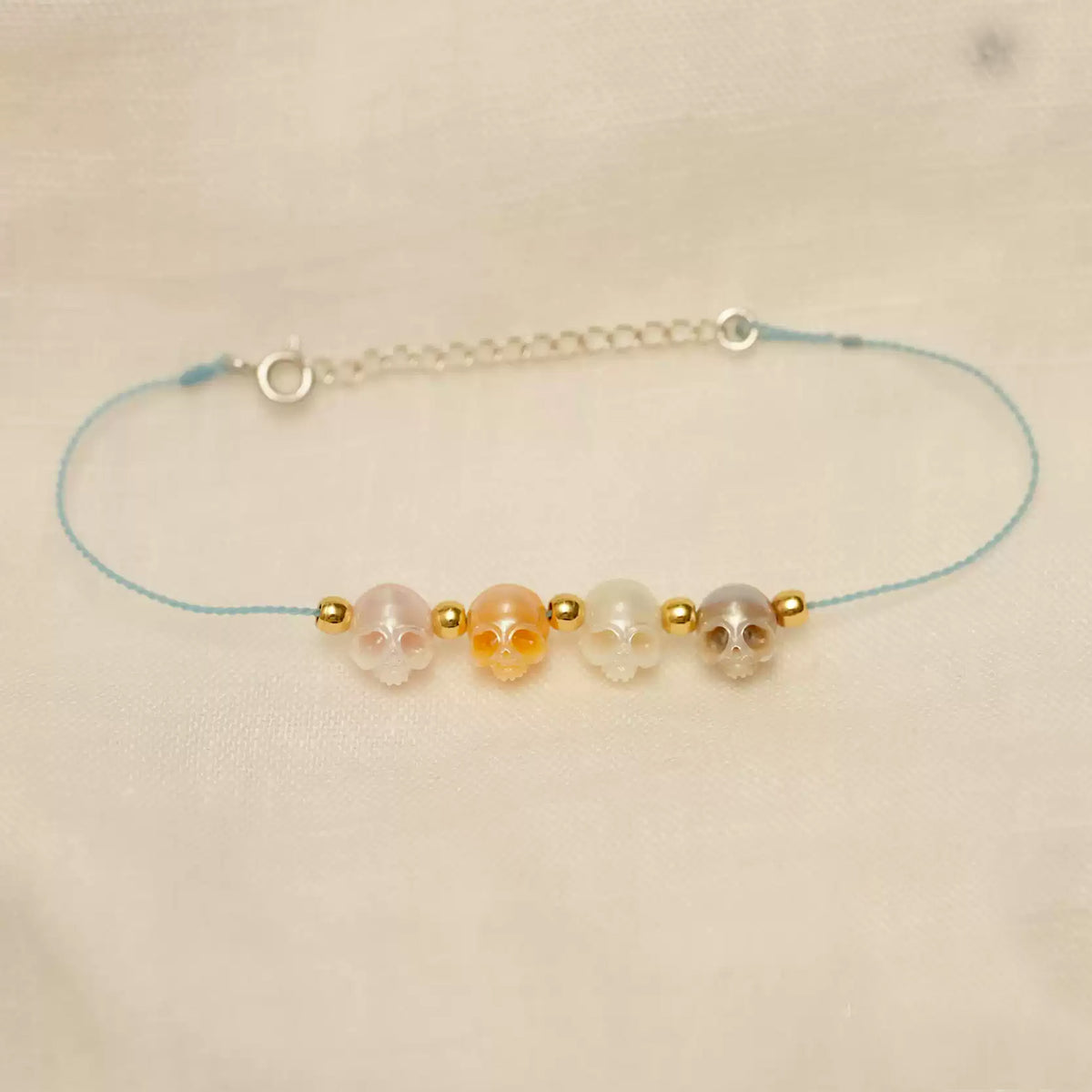 Hand-carved natural pearl bracelet with braided wax cord
