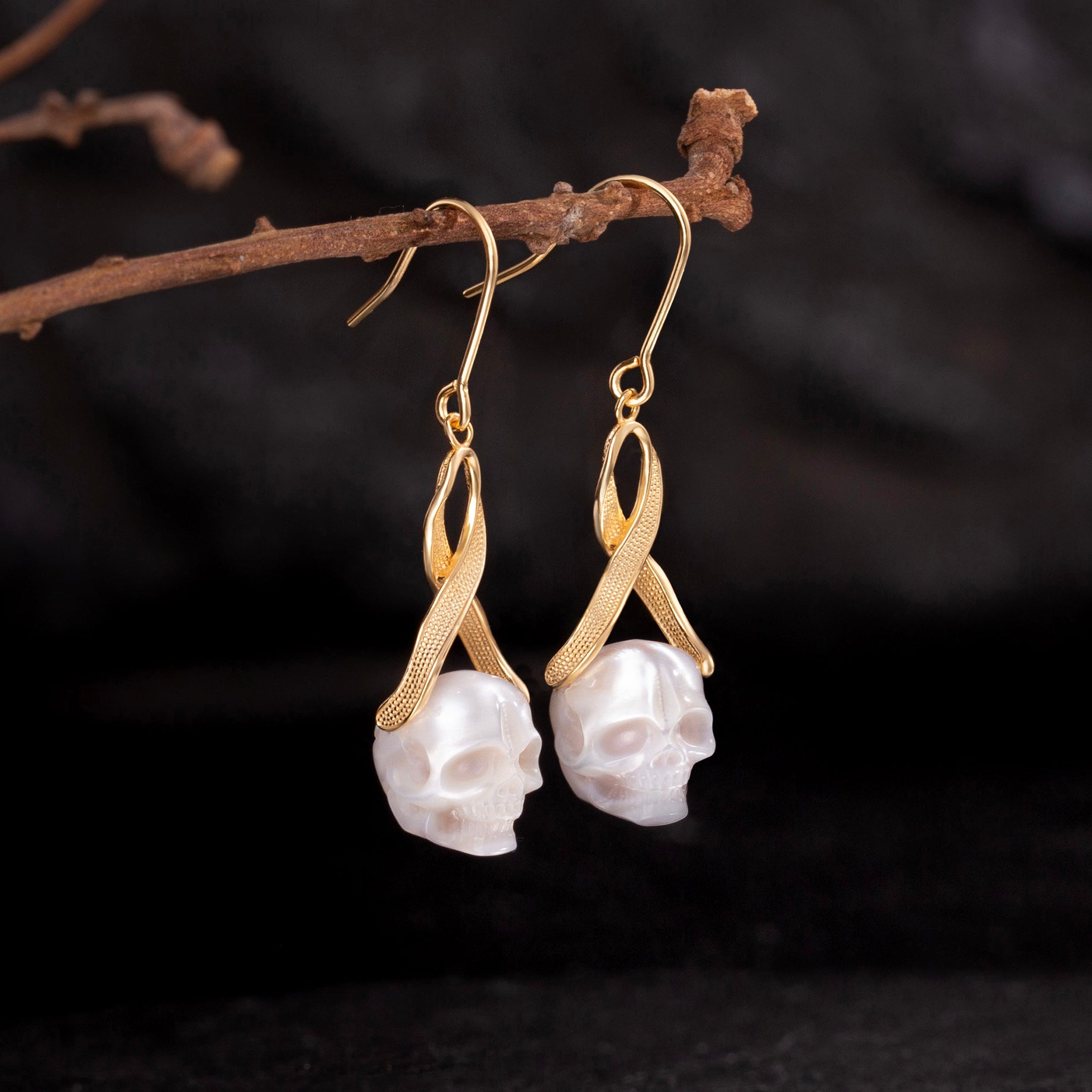 Interlaced Ribbon Pearl Skull Earrings