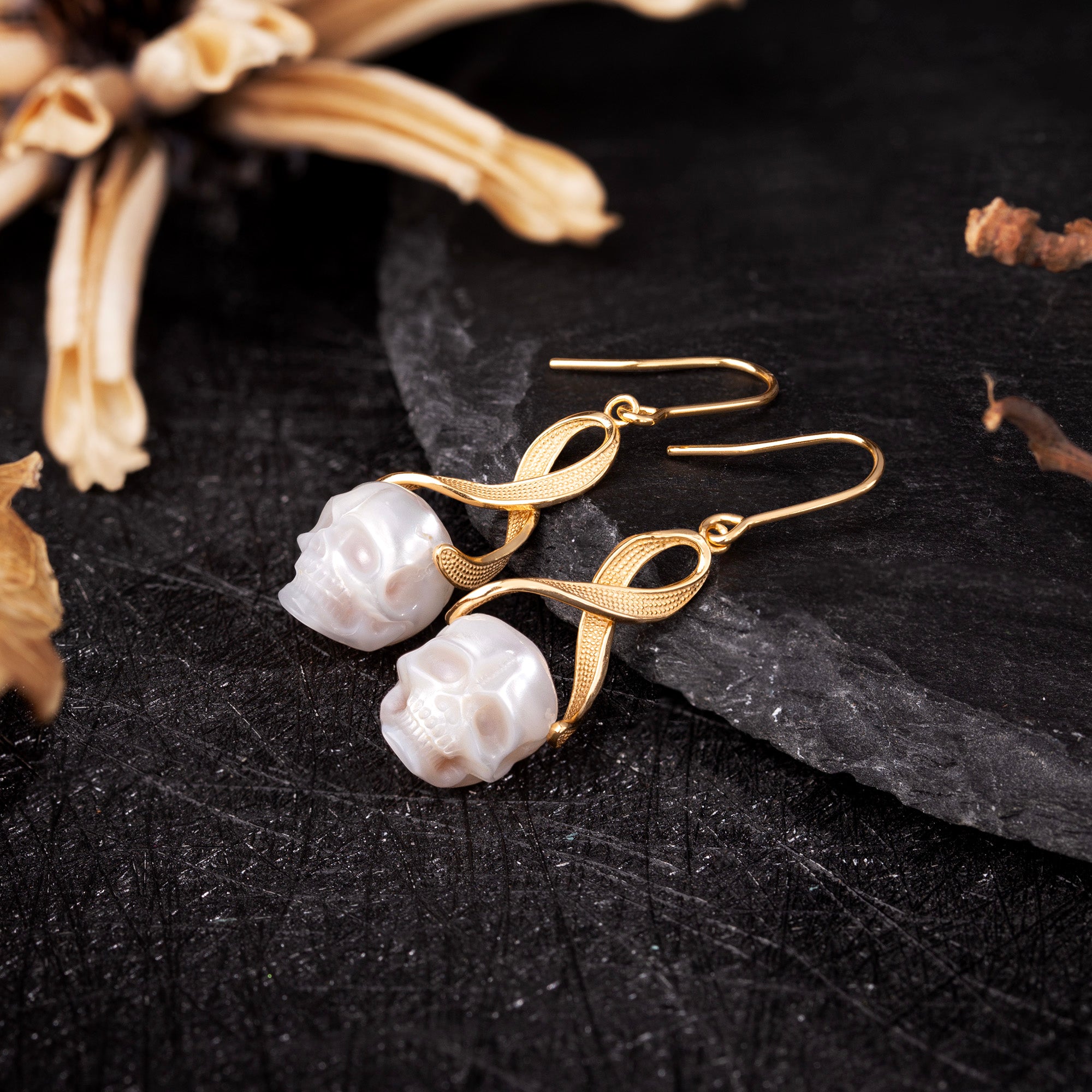 Interlaced Ribbon Pearl Skull Earrings