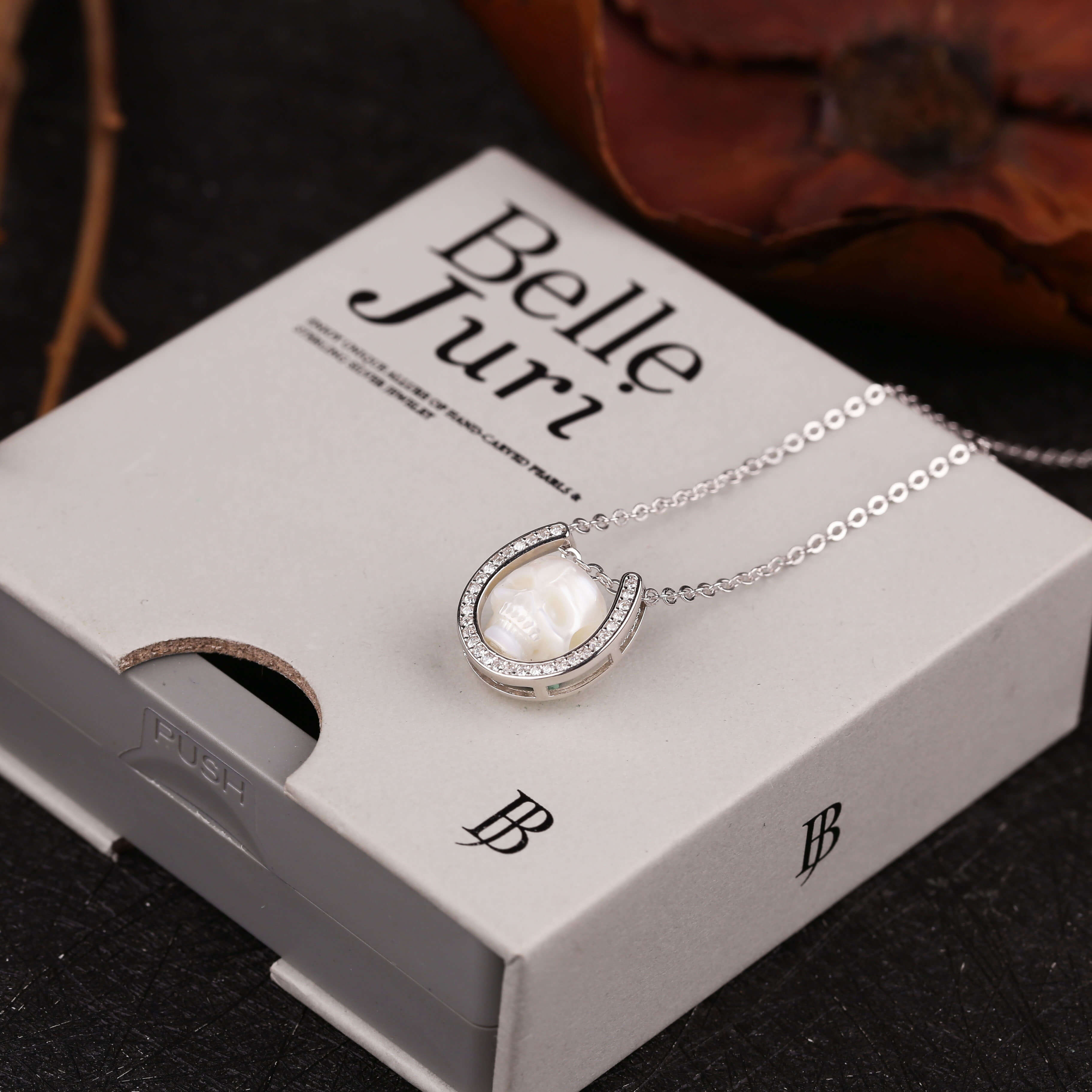 Minimalist Carved Pearl Skull with U‑Shaped Frame Necklace