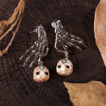 Boucles d'oreilles en peigne de perle de squelette punk