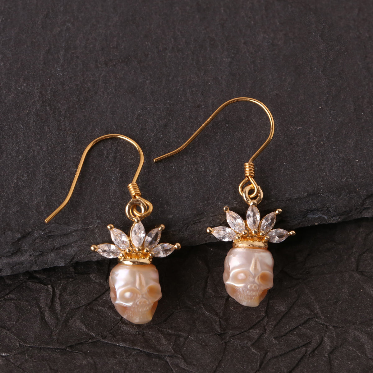 Zircon Crowned Carved Pearl Skull Earrings